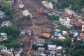 Quase 130 casas e outros edif&iacute;cios foram destru&iacute;dos, ou danificados, no deslizamento de terra  - Japan Weather Landslide/ AFP