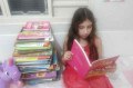 Paixão da menina pela leitura começou desde pequena, com incentivo da mãe. - ARQUIVO PESSOAL