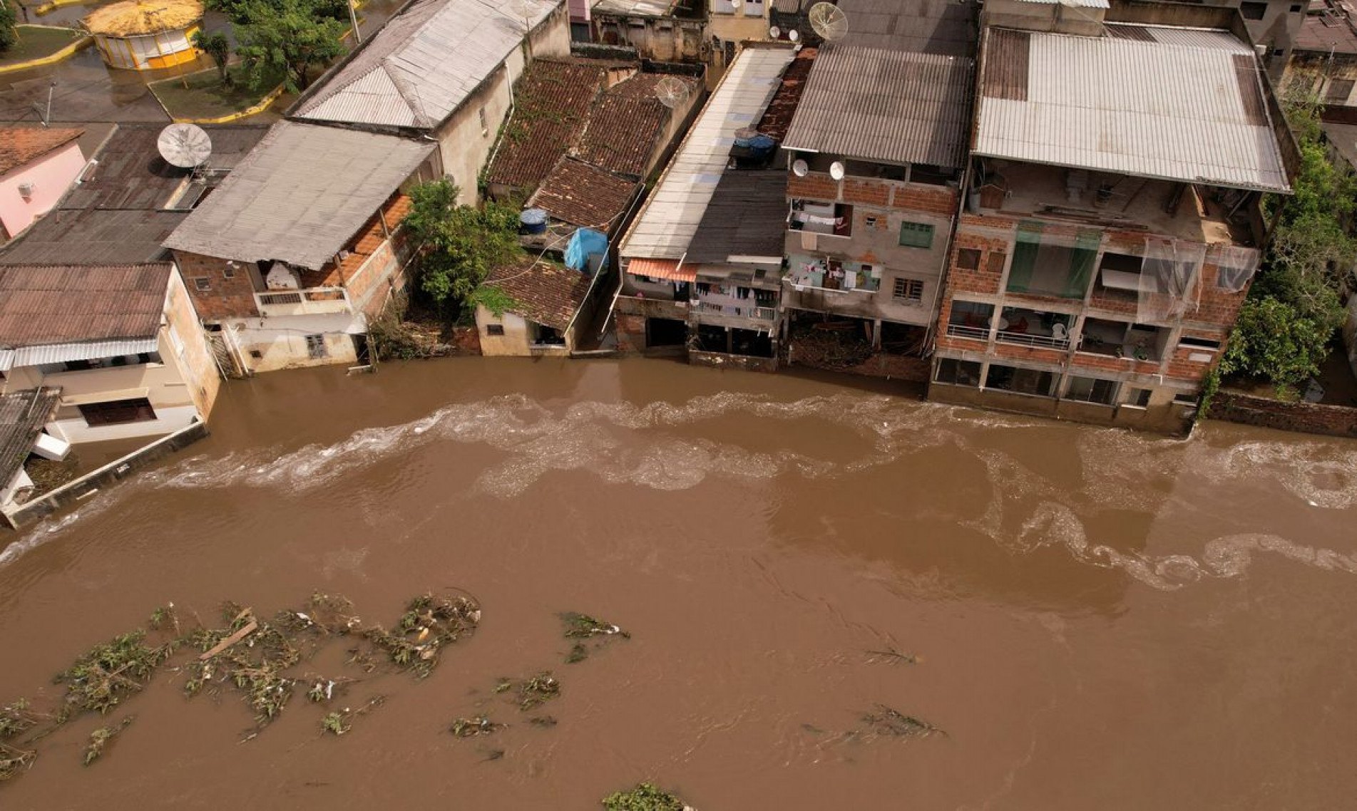  An aerial view shows a flooded street, caused due to heavy rains, in Itajuipe, Bahia state, Brazil December 27, 2021. Picture taken with a drone. REUTERS/Amanda Perobelli.
    