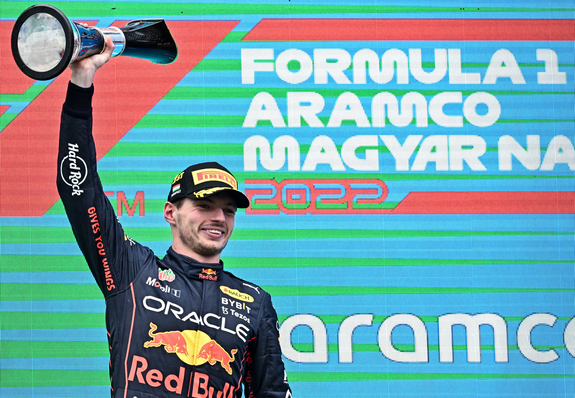  Winner Red Bull Racing's Dutch driver Max Verstappen celebrates with the trophy on the podium after the Formula One Hungarian Grand Prix at the Hungaroring in Mogyorod near Budapest, Hungary, on July 31, 2022. (Photo by Attila KISBENEDEK / AFP)
      