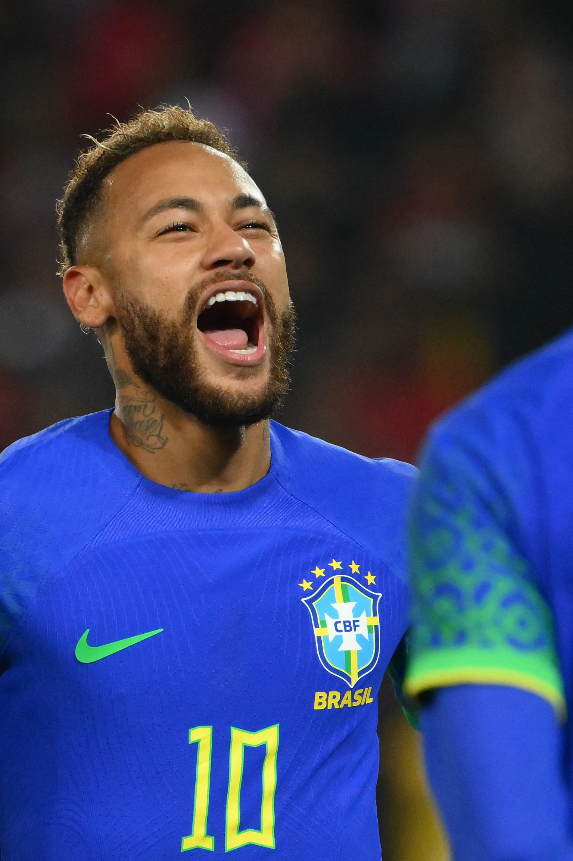  Brazil's forward Neymar celebrates scoring his team's third goal during the friendly football match between Brazil and Tunisia at the Parc des Princes in Paris on September 27, 2022. (Photo by Anne-Christine POUJOULAT / AFP)