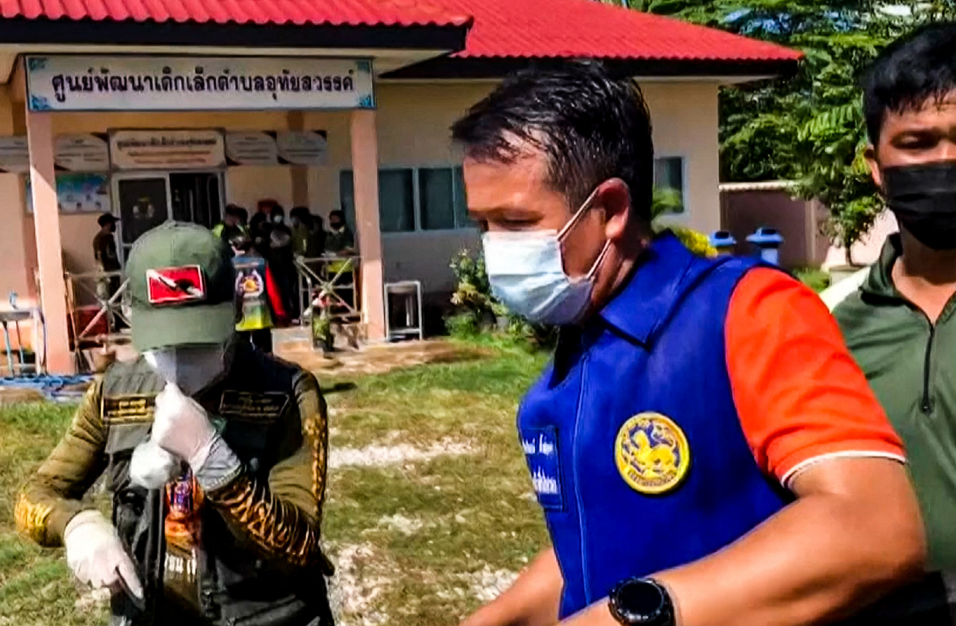  This frame grab from video footage by Thai PBS made available via AFPTV and taken on October 6, 2022 shows officials outside a nursery in the northern Thai province of Nong Bua Lam Phu, where a former policeman shot dead at least 30 people in a mass shooting. A former police officer stormed a nursery in Thailand on October 6, shooting dead at least 30 people, most of them children, before killing himself and his family. - -----EDITORS NOTE --- RESTRICTED TO EDITORIAL USE - MANDATORY CREDIT 