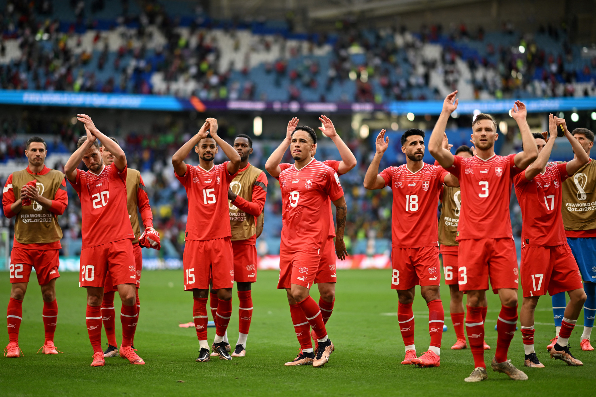  Switzerland players applaud supporters at the end of the Qatar 2022 World Cup Group G football match between Switzerland and Cameroon at the Al-Janoub Stadium in Al-Wakrah, south of Doha on November 24, 2022. (Photo by Kirill KUDRYAVTSEV / AFP)