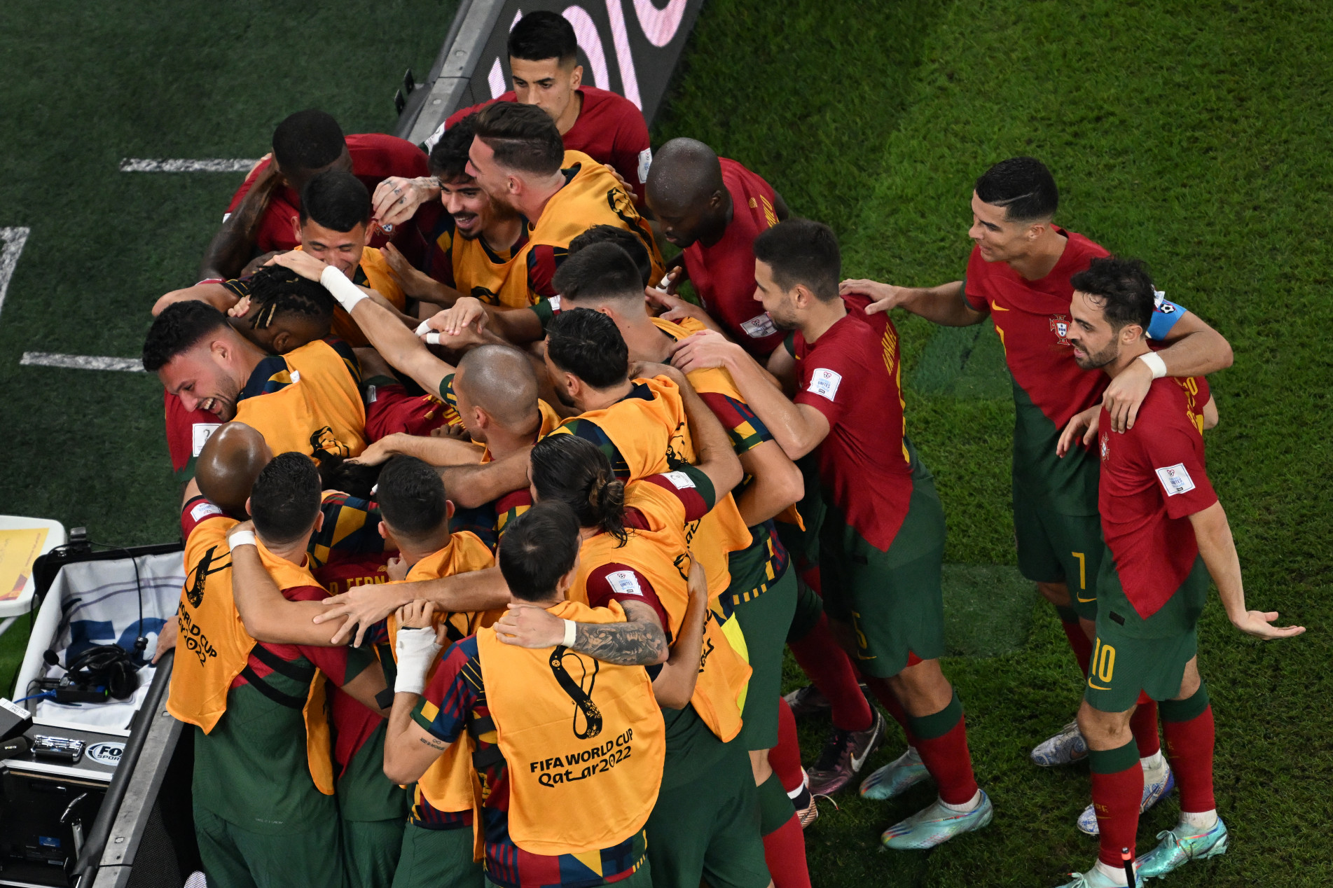  Portugal's forward #15 Rafael Leao (L, partially covered) celebrates with teammates scoring his team's third goal during the Qatar 2022 World Cup Group H football match between Portugal and Ghana at Stadium 974 in Doha on November 24, 2022. (Photo by Kirill KUDRYAVTSEV / AFP)