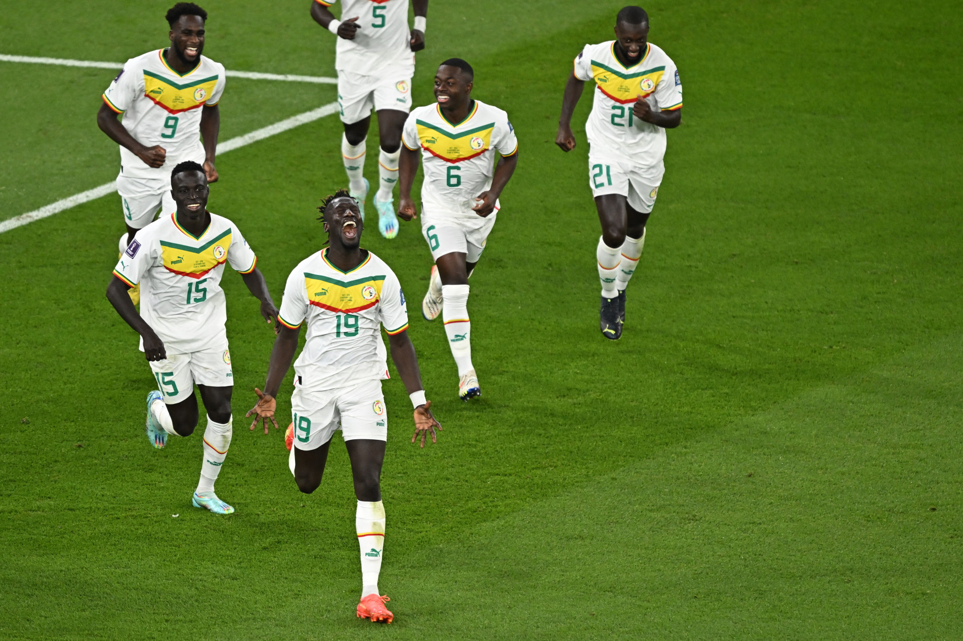  Senegal's forward #19 Famara Diedhiou celebrates scoring his team's second goal with his teammates during the Qatar 2022 World Cup Group A football match between Qatar and Senegal at the Al-Thumama Stadium in Doha on November 25, 2022. (Photo by MANAN VATSYAYANA / AFP)