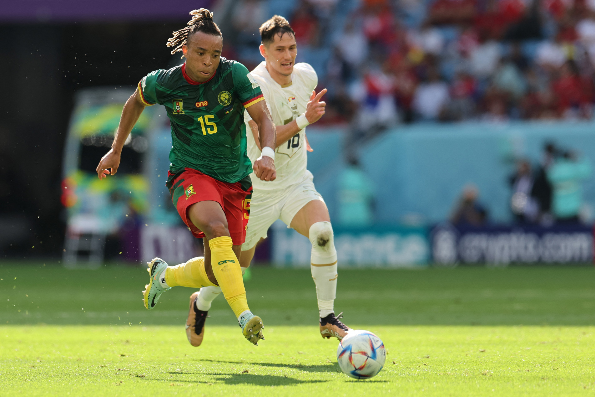  Cameroon's midfielder #15 Pierre Kunde fights for the ball with Serbia's midfielder #16 Sasa Lukic during the Qatar 2022 World Cup Group G football match between Cameroon and Serbia at the Al-Janoub Stadium in Al-Wakrah, south of Doha on November 28, 2022. (Photo by Giuseppe CACACE / AFP)