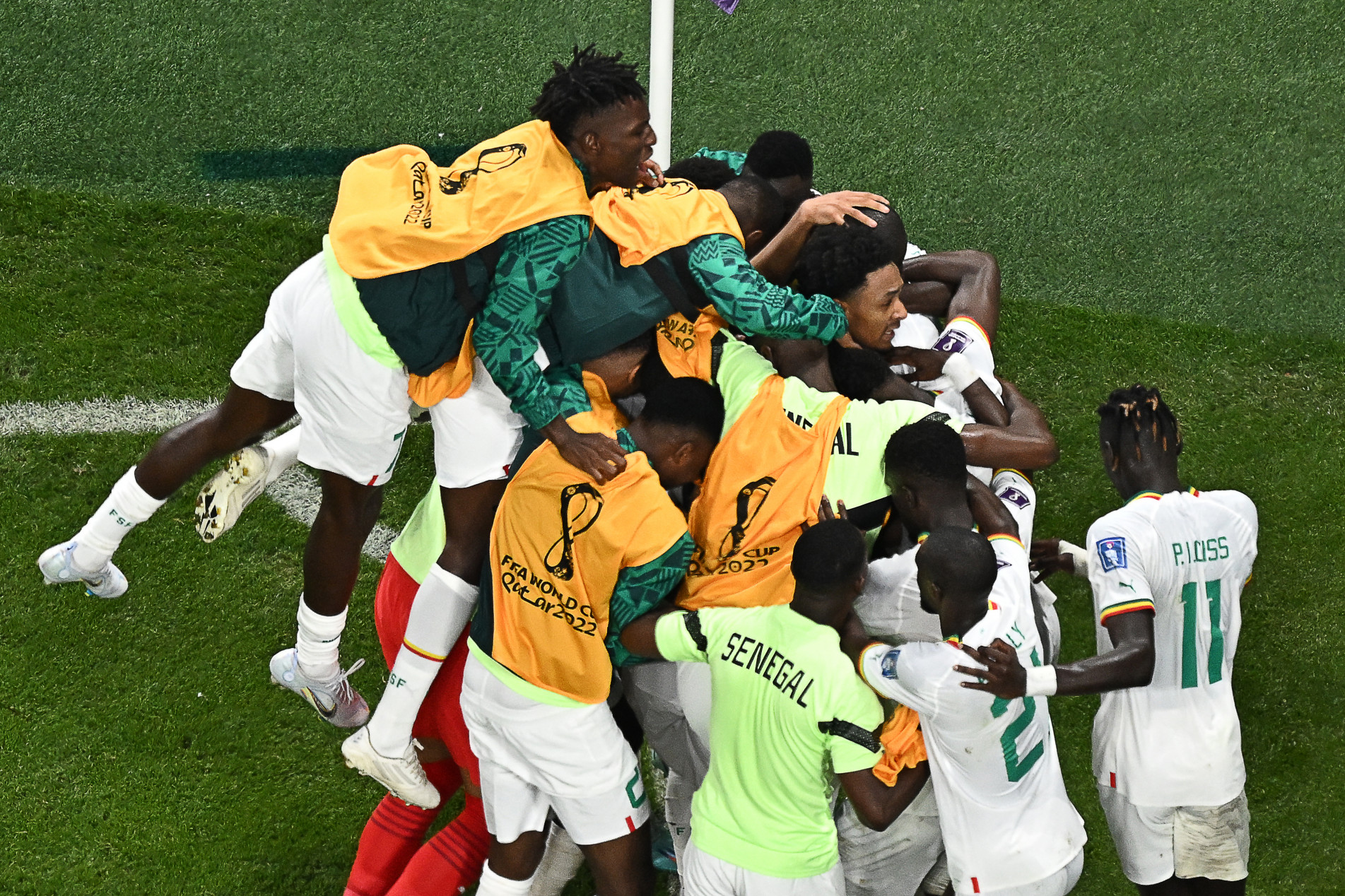  Senegal's defender #03 Kalidou Koulibaly (covered) celebrates scoring his team's second goal during the Qatar 2022 World Cup Group A football match between Ecuador and Senegal at the Khalifa International Stadium in Doha on November 29, 2022. (Photo by MANAN VATSYAYANA / AFP)