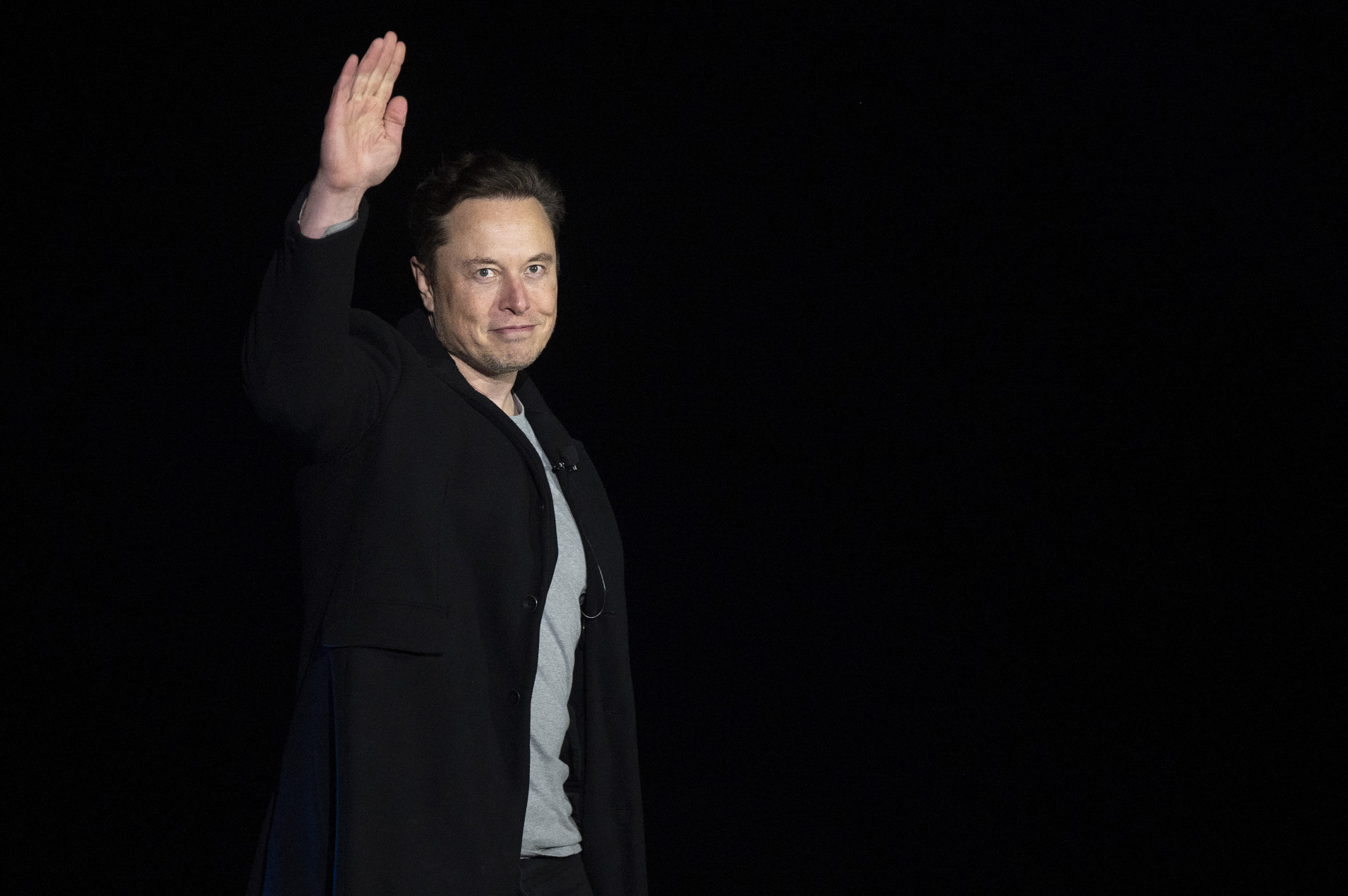  (FILES) In this file photo taken on February 10, 2022 Elon Musk gestures as he speaks during a press conference at SpaceX's Starbase facility near Boca Chica Village in South Texas. - Elon Musk late Tuesday said he will resign as chief executive of Twitter once he finds a replacement, in apparent respect of a poll he himself launched that revealed users wanted him to step down.

