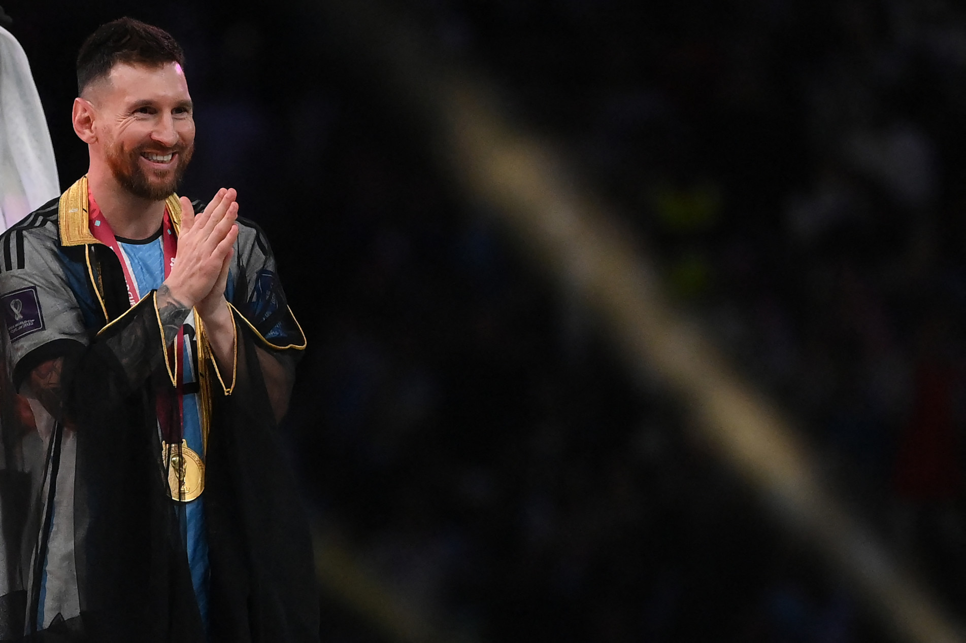  Argentina's forward #10 Lionel Messi gestures during the Qatar 2022 World Cup trophy ceremony after the football final match between Argentina and France at Lusail Stadium in Lusail, north of Doha on December 18, 2022. - Argentina won in the penalty shoot-out. (Photo by FRANCK FIFE / AFP)