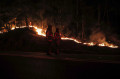 Os inc&ecirc;ndios j&aacute; deixaram ao menos 24 mortos e pelo menos 2.196 feridos - JAVIER TORRES / AFP