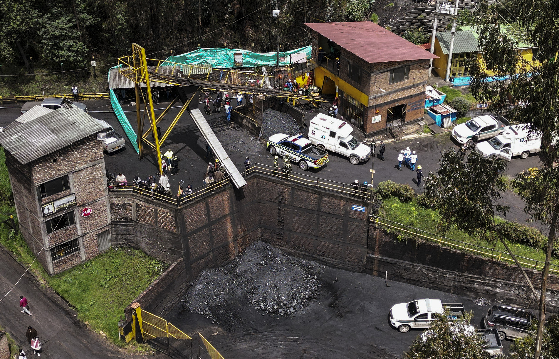 Aerial view showing the site where rescuers try to reach ten miners trapped after an explosion at a coal mine in Sutatausa municipality in the department of Cundinamarca, Colombia on March 15, 2023. - Rescuers work against the clock this Wednesday in the search for ten people trapped in a coal mine in central Colombia after an explosion killed 11 workers, while the chances of finding survivors are running out due to the lack of oxygen in the tunnel. (Photo by Daniel MUNOZ / AFP)