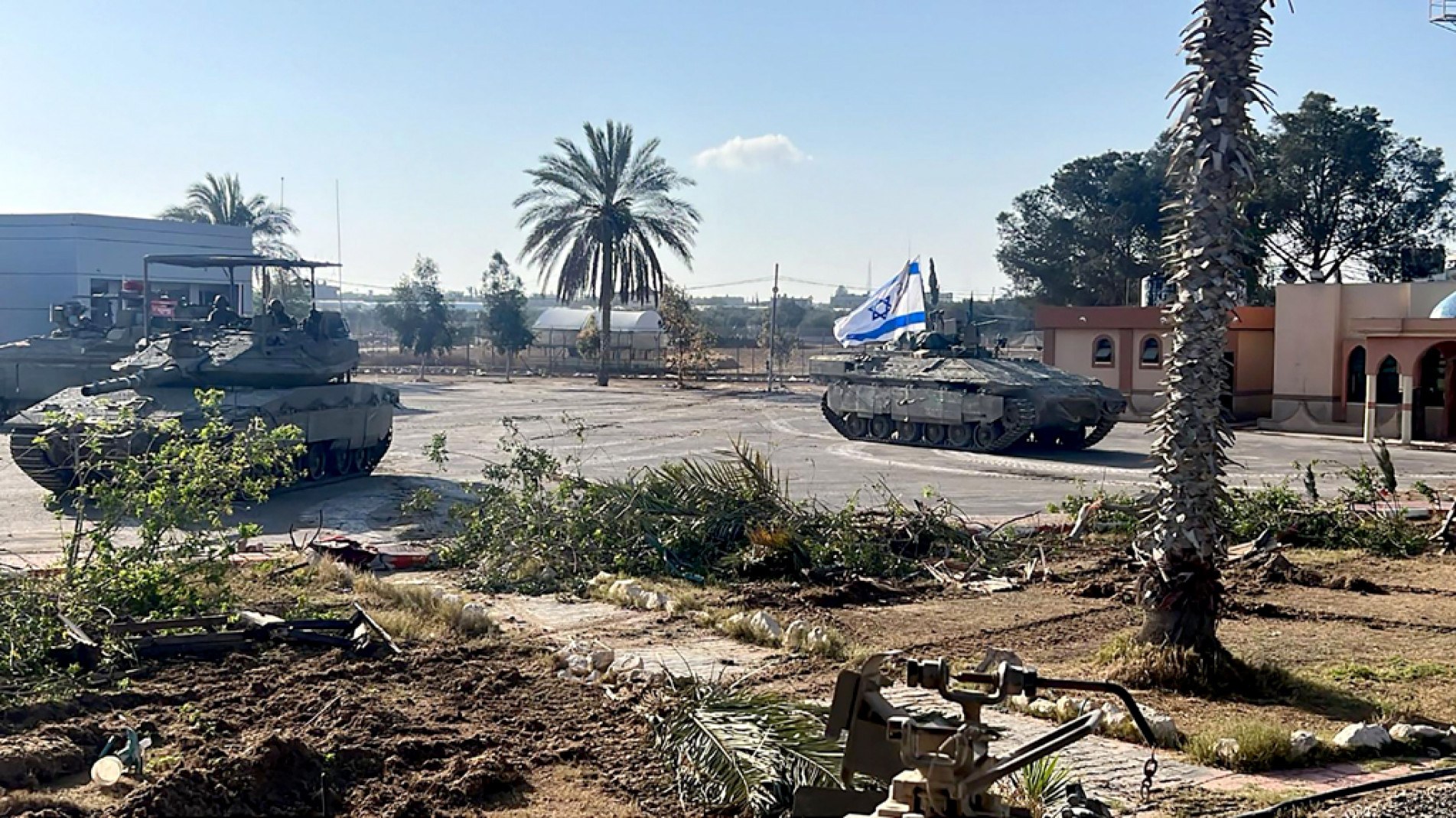 This handout picture released by the Israeli army shows the 401st Brigade's combat team tanks entering the Palestinian side of the Rafah border crossing between Gaza and Egypt in the southern Gaza Strip on May 7, 2024. The Israeli army said it took 