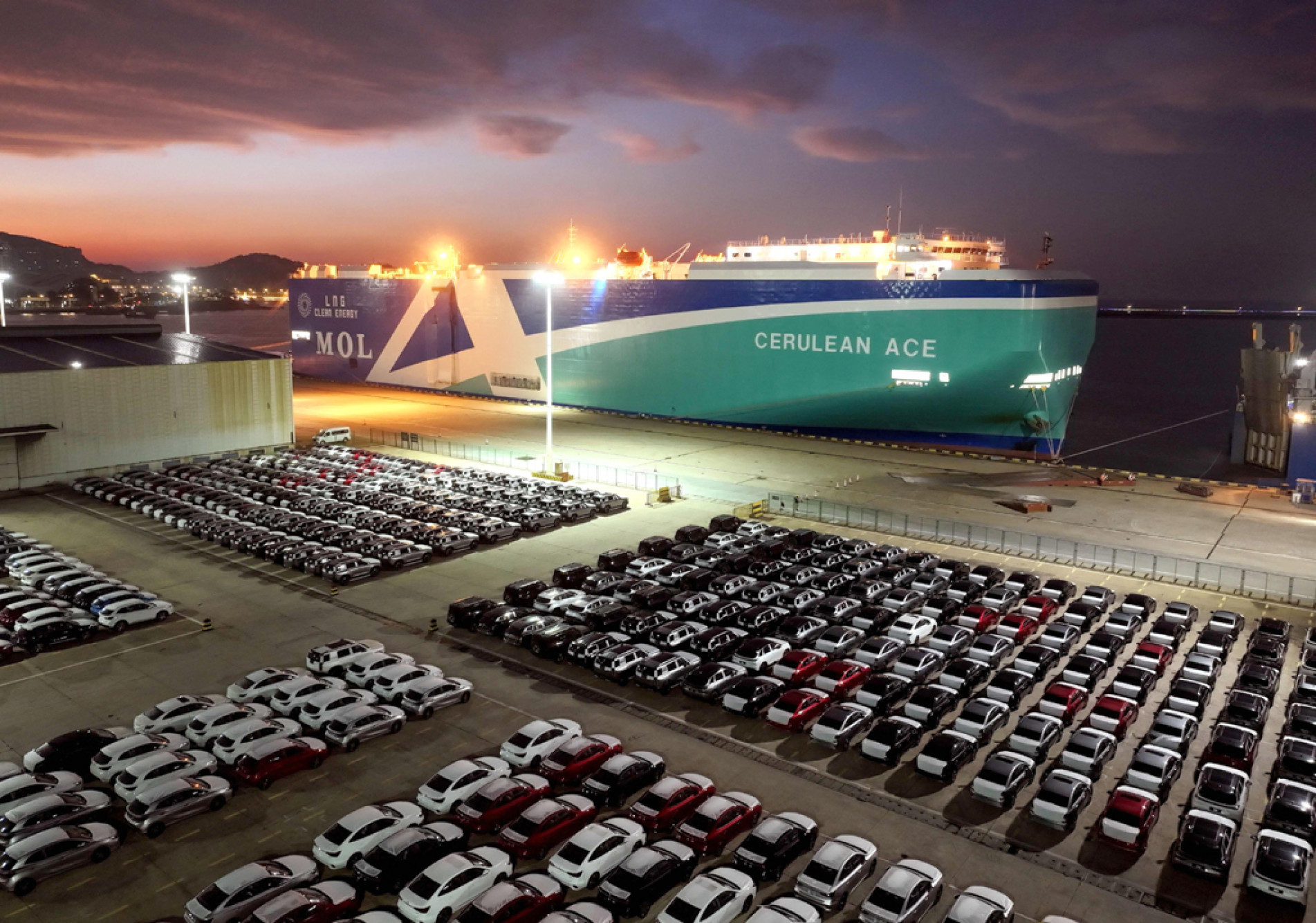  Cars made by China?s SAIC are seen at the port in Lianyungang, in China?s eastern Jiangsu province before being loaded onto a ship for export on September 25, 2025. (Photo by AFP) / China OUT
      Caption
