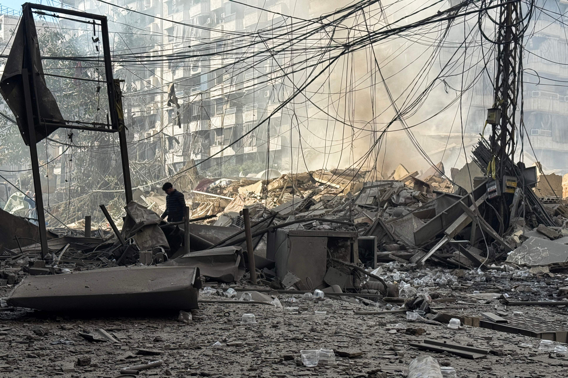 A man looks at the debris at a site of an Israeli airstrike in the southern suburbs of Beirut on March 3, 2026. The war launched by the United States and Israel against Iran spread across the Middle East, threatening to plunge the global economy into chaos, with Lebanon and Gulf energy exporters dragged into the conflict. (Photo by AFP stringer / AFP)