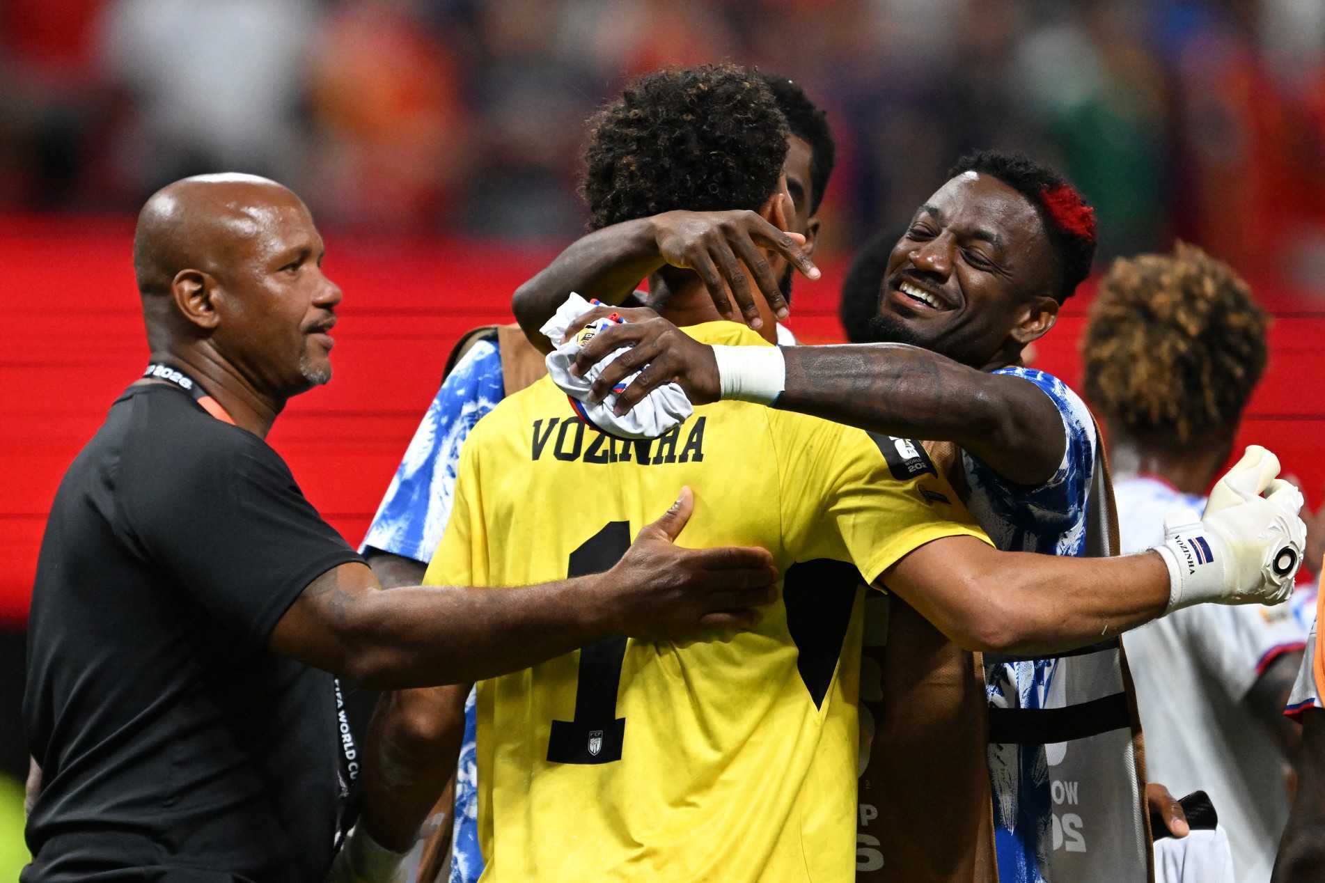  Cape Verde's goalkeeper #01 Vozinha (C) is congratulated by staff and teammates at the end of the 2026 World Cup Group H football match between Spain and Cape Verde at the Atlanta Stadium in Atlanta on June 15, 2026.  (Photo by Roberto SCHMIDT / AFP)